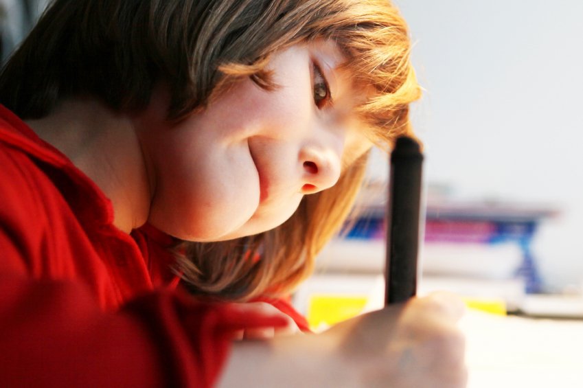 Little girl writing