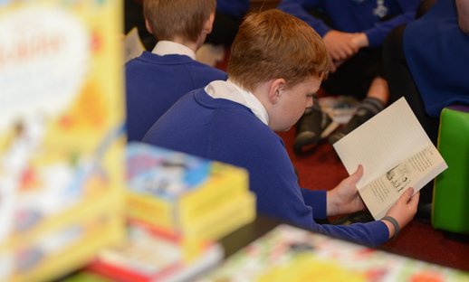 Boy reading classroom