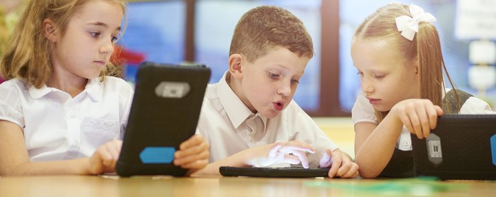 Boy and girl with technology tablet reading