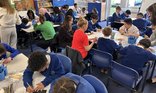 Busy primary school classroom learning environment