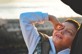 Child boy outside Community National Literacy Trust