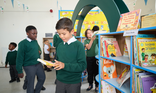 Primary children in school library