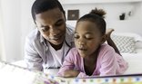 Dad and daughter reading