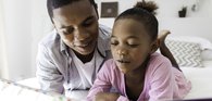 Dad and daughter reading