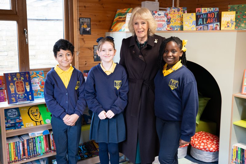 Her Majesty The Queen meeting three pupil librarians from Christ Church Primary School in their new school library