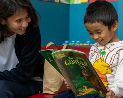 EWM The Gruffalo_Liverpool launch_child reads The Gruffalo with his mum