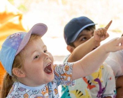 Two children pointing with joy