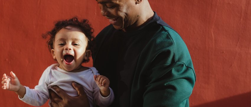 Dad and baby Early Words Matter close up