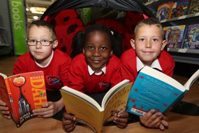 Kids reading in tent.JPG