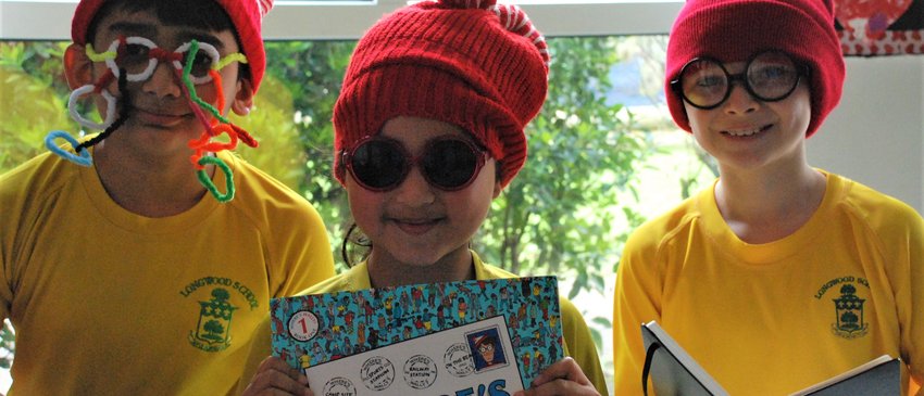 School kids with Where's Wally glasses and books