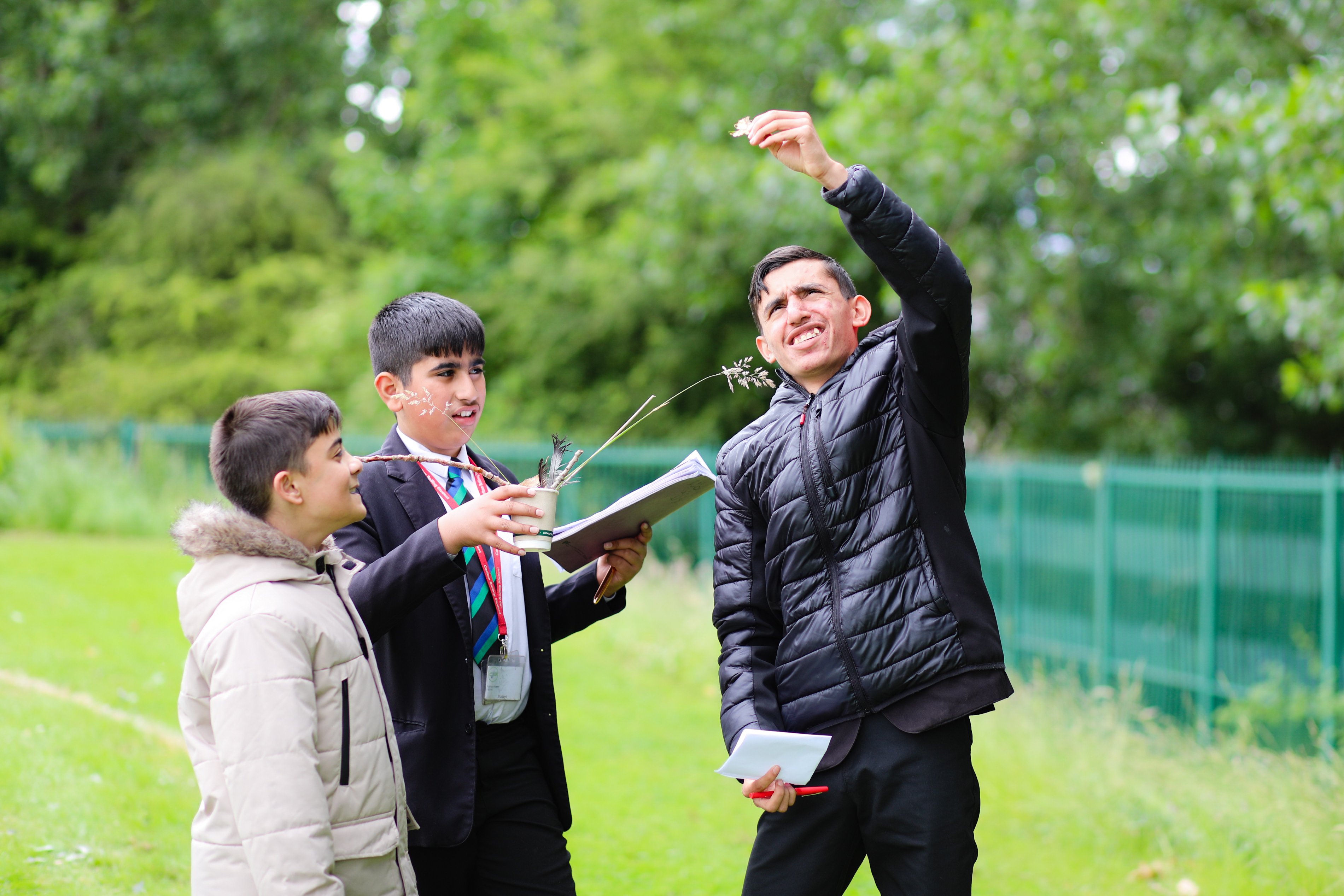 Students examining natural world for poetry workshop