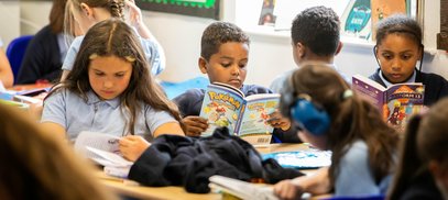 Children read books in school. Drake Circus - Young Readers Programme