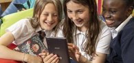 Children reading humorous book