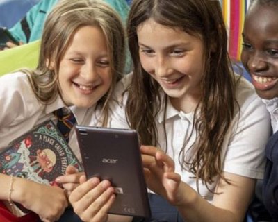 Children reading humorous book