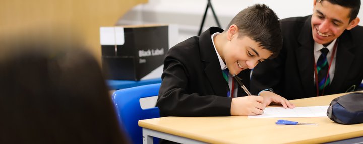 Secondary school young people boys  classroom writing_National Literacy Trust