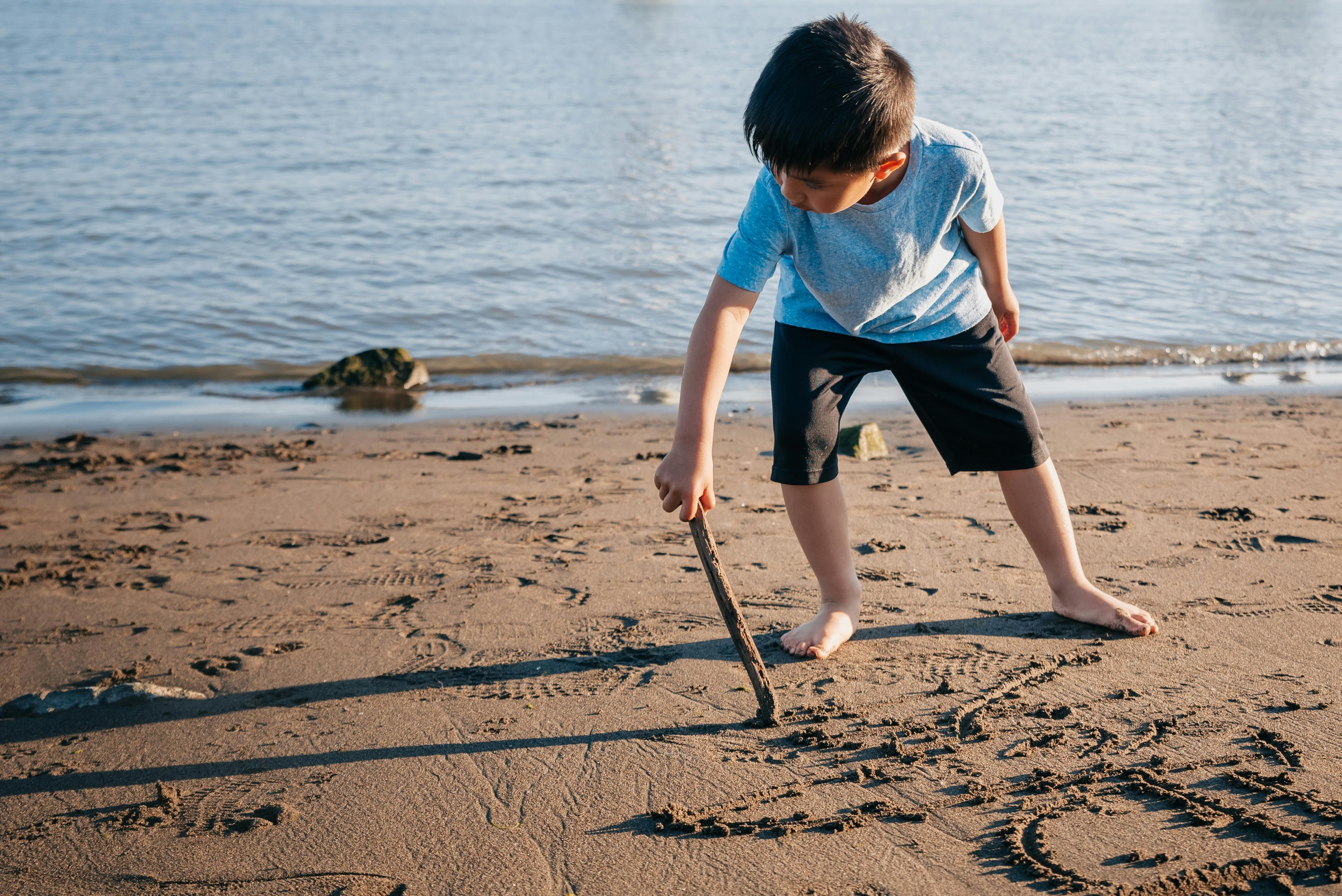 Stanley's Stick boy writing in sand
