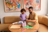 Dad and daughter listening to audio story - tonies