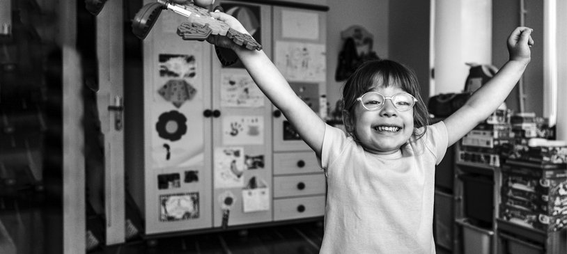 Young girl on her own looking happy