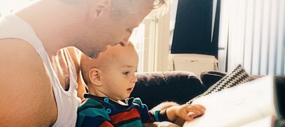 Dad sharing book with child attachment theory