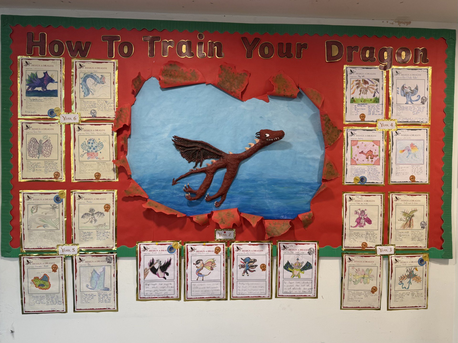 Display of How To Train Your Dragon artwork in school library