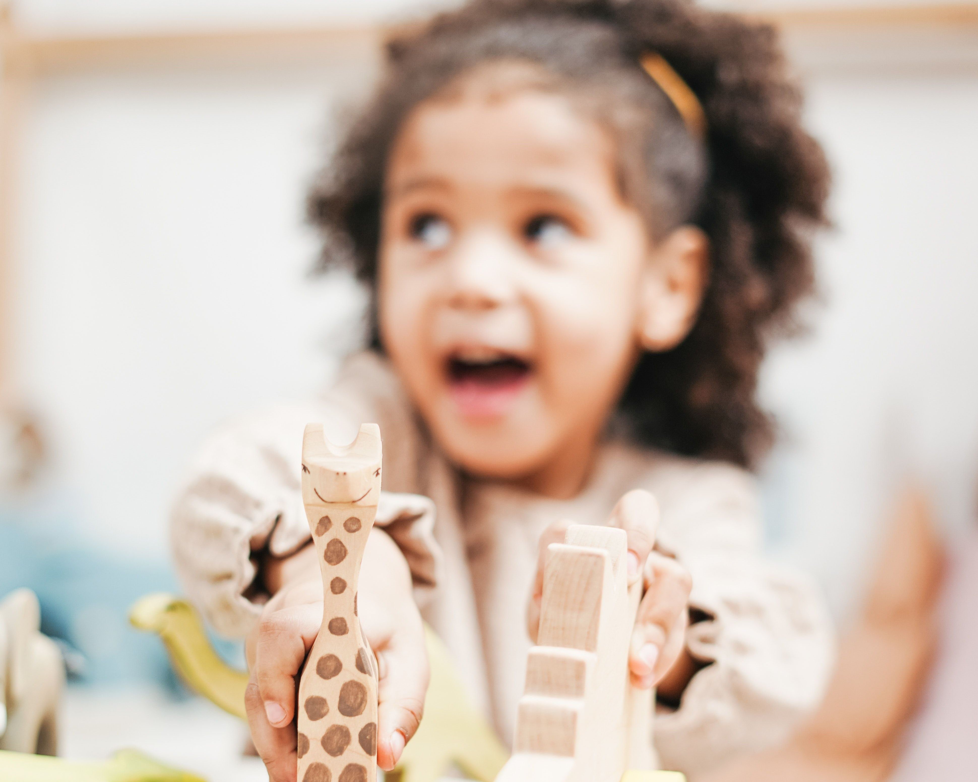 Young child with wooden toys