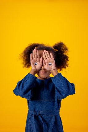 Child with googly eyes on hands_comic relief_pexels